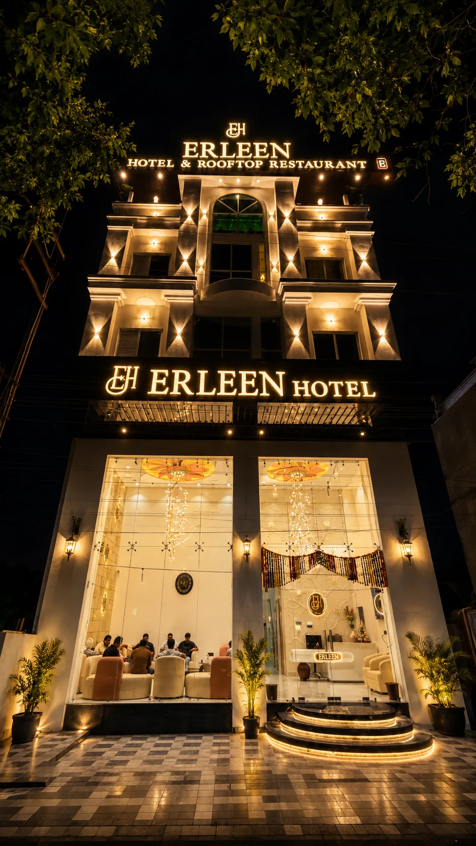 Erleen Hotel & Rooftop Restaurant exterior at night in Indore