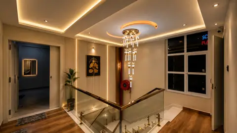 Staircase corridor with warm ambient lighting at Erleen Hotel