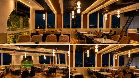 Rooftop restaurant seating at Erleen Hotel in the evening